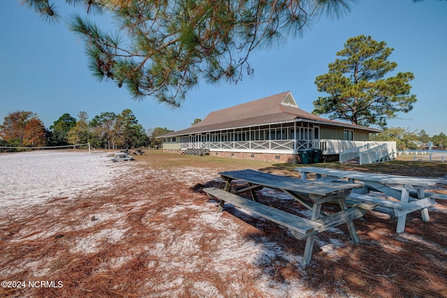 view of yard featuring a sunroom