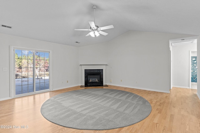 living room with light wood-type flooring, ceiling fan, and lofted ceiling