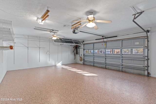 garage with ceiling fan and a garage door opener