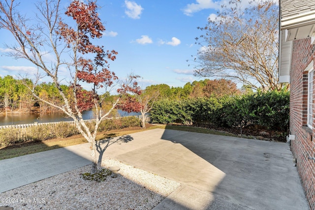 7319 Thurgood Rd, Wilmington, NC 28411 - fenced backyard with a water view and a patio area