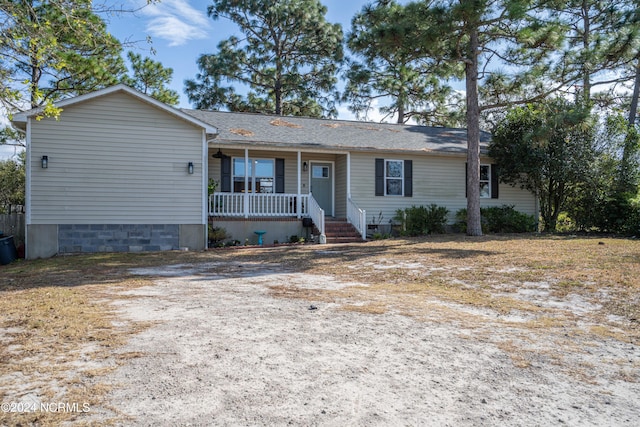 ranch-style home with a porch