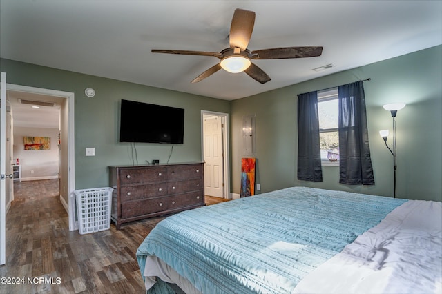 bedroom with dark wood-type flooring and ceiling fan