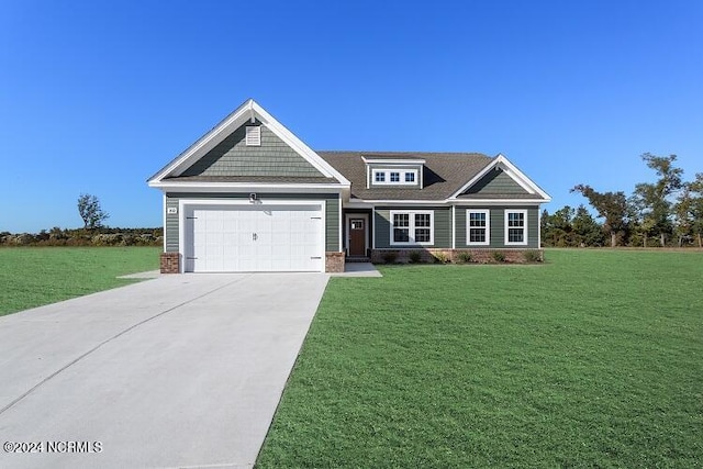 craftsman house with a front lawn and a garage