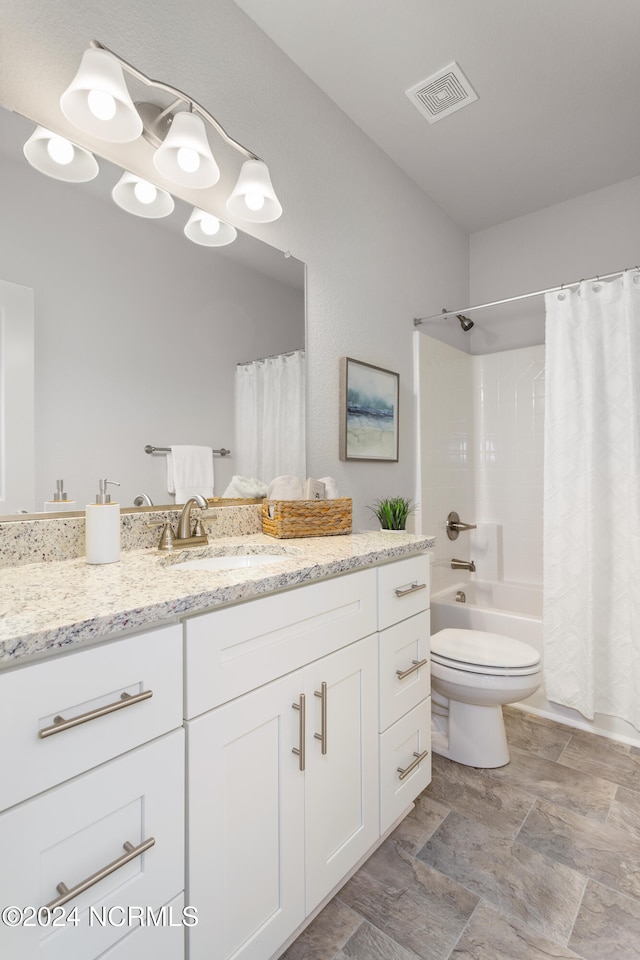 full bathroom with vanity, toilet, and shower / bath combo