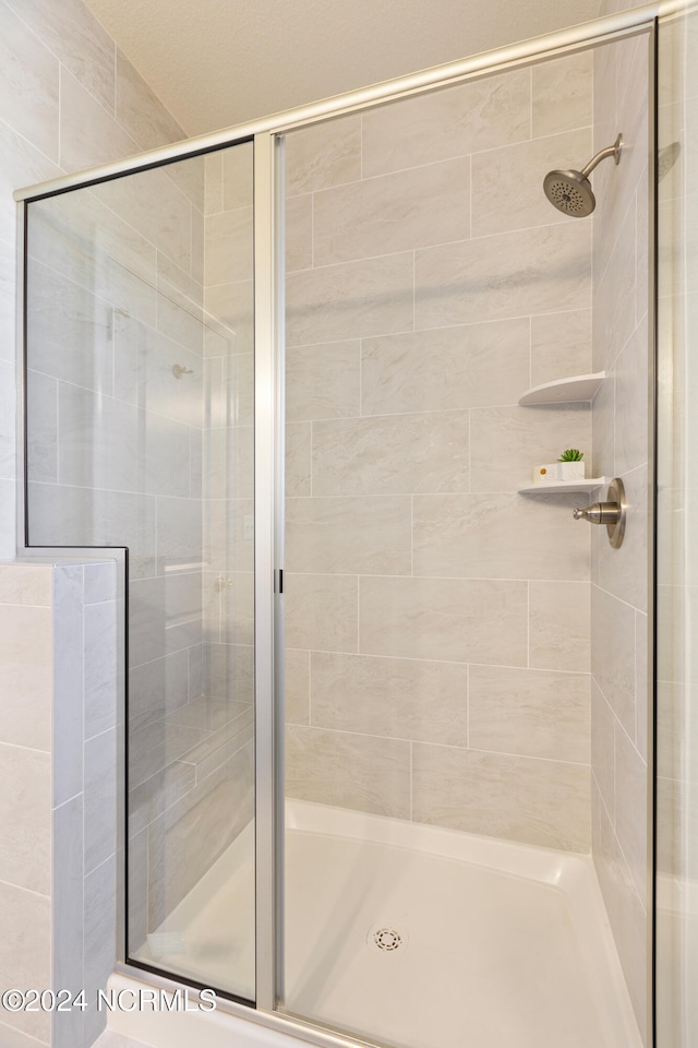 bathroom with an enclosed shower