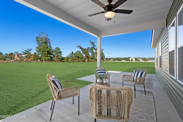 view of patio / terrace with ceiling fan and an outdoor living space