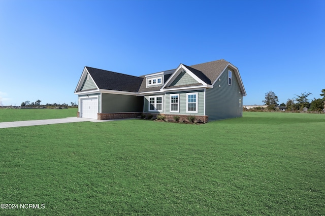 view of front of house with a front lawn and a garage