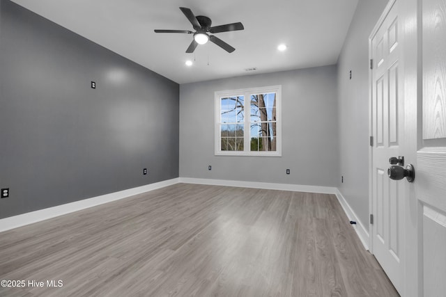 unfurnished room featuring a ceiling fan, recessed lighting, light wood-style flooring, and baseboards