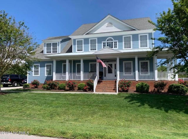 view of front of property with a porch and a front lawn