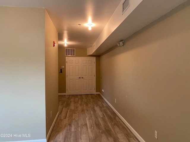 hallway featuring hardwood / wood-style flooring