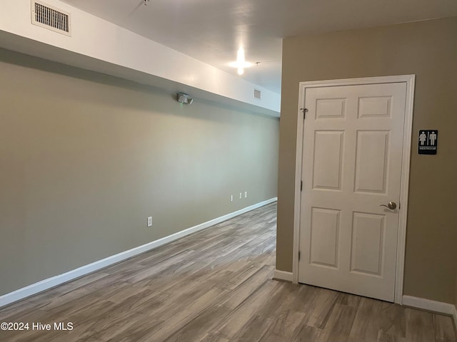 unfurnished room with light hardwood / wood-style floors