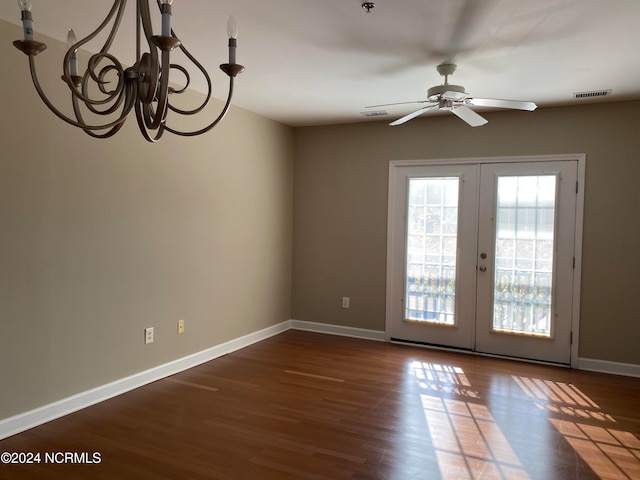 interior space with ceiling fan, dark hardwood / wood-style flooring, and french doors