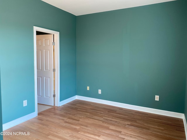 unfurnished room featuring light wood-type flooring