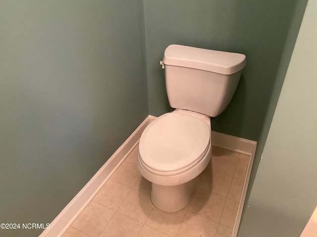 bathroom featuring tile patterned flooring and toilet