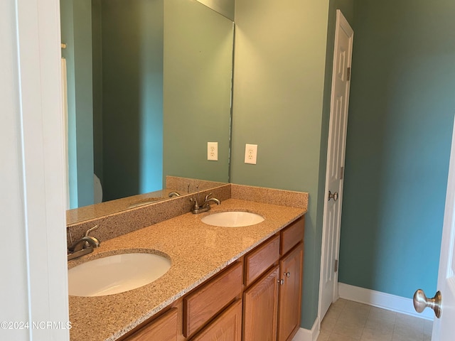 bathroom with tile patterned flooring and vanity