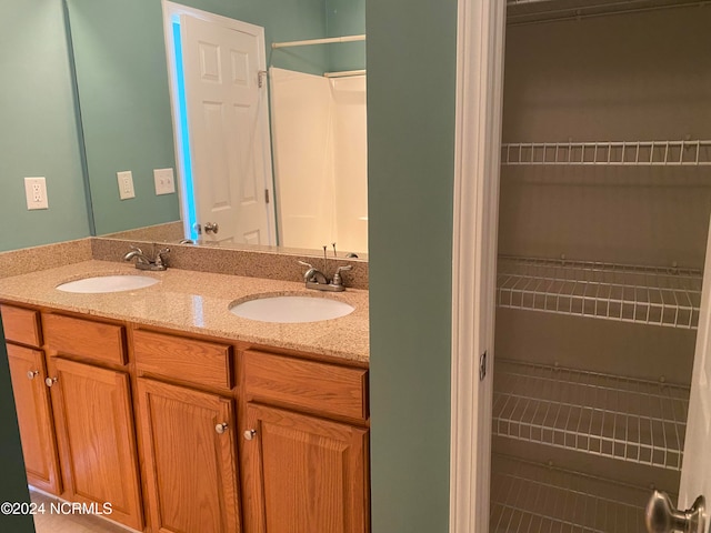 bathroom with vanity and tile patterned floors