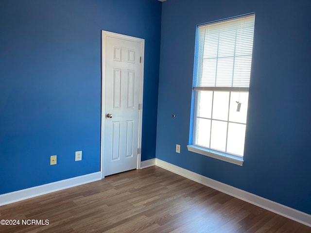 empty room featuring hardwood / wood-style flooring