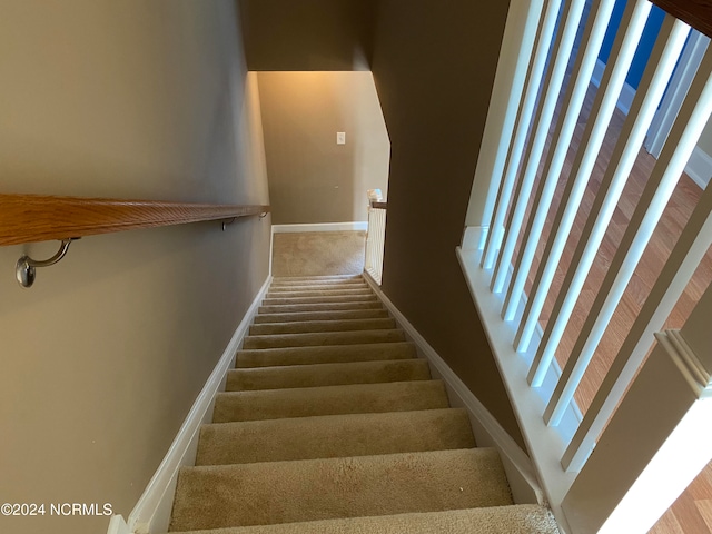 staircase with carpet and a wealth of natural light