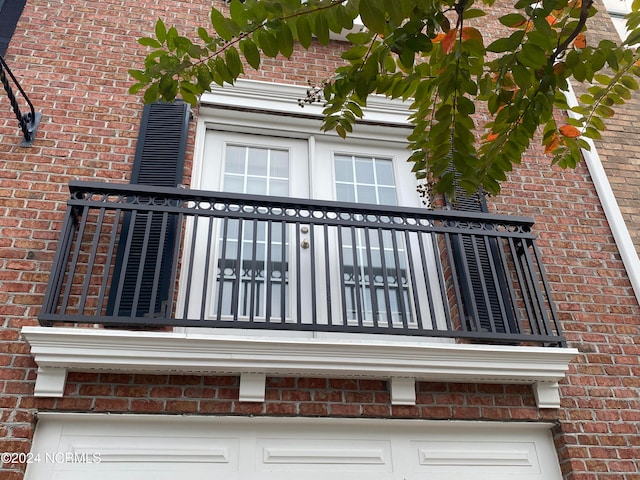 view of home's exterior with a balcony