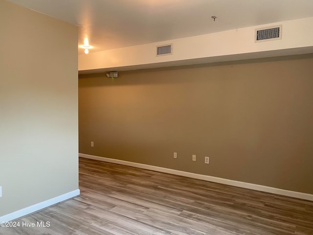 empty room featuring wood-type flooring