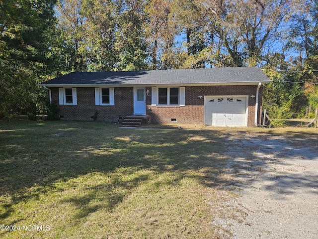 ranch-style home with a front yard and a garage