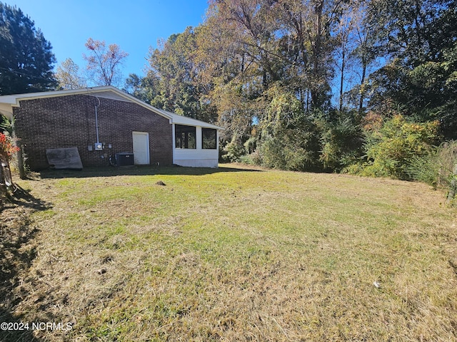 view of yard with central air condition unit