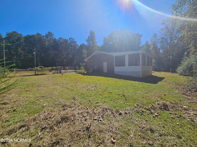 view of yard featuring a sunroom