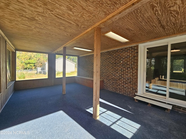 exterior space with wood ceiling