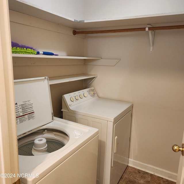 clothes washing area featuring washing machine and dryer