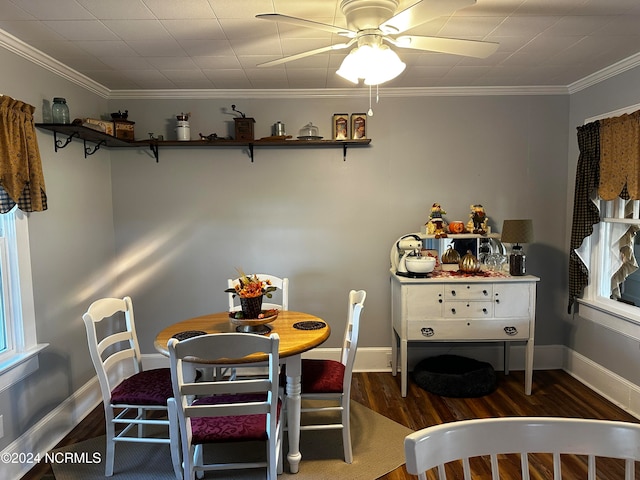 dining room with crown molding, dark wood-type flooring, and ceiling fan