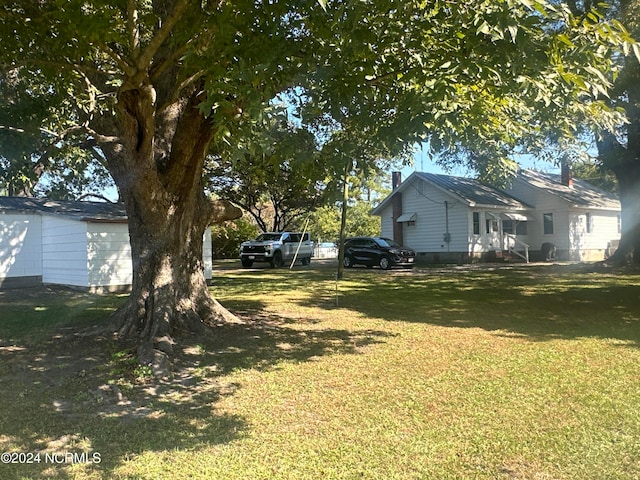 view of yard featuring a garage