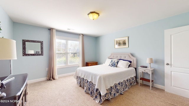 bedroom with light carpet