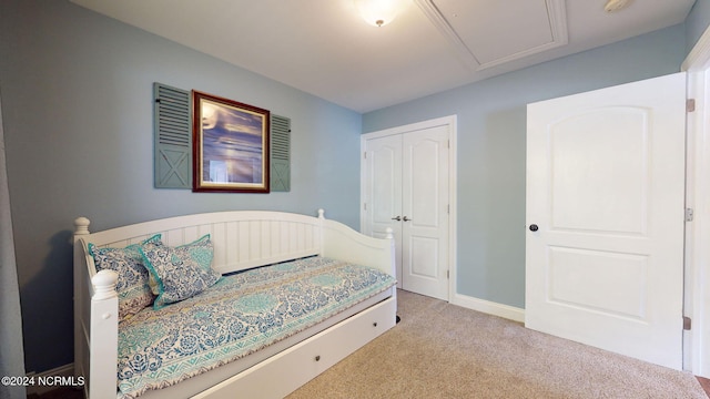 carpeted bedroom featuring a closet