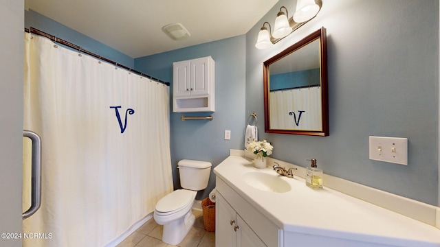 bathroom featuring vanity, toilet, and tile patterned floors