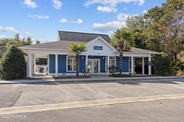 view of front of home featuring french doors and covered porch