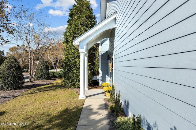 view of home's exterior featuring a yard