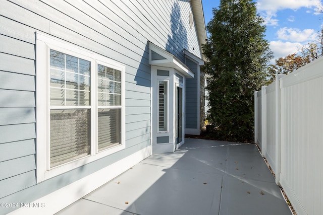 view of property exterior with a patio