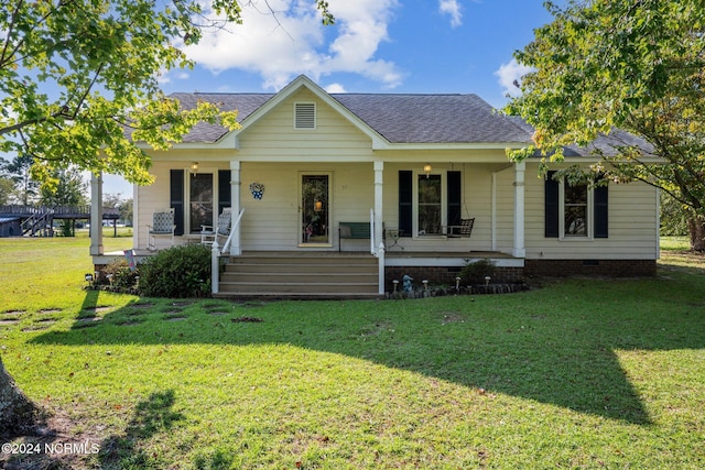 view of front of home featuring covered porch and a front yard