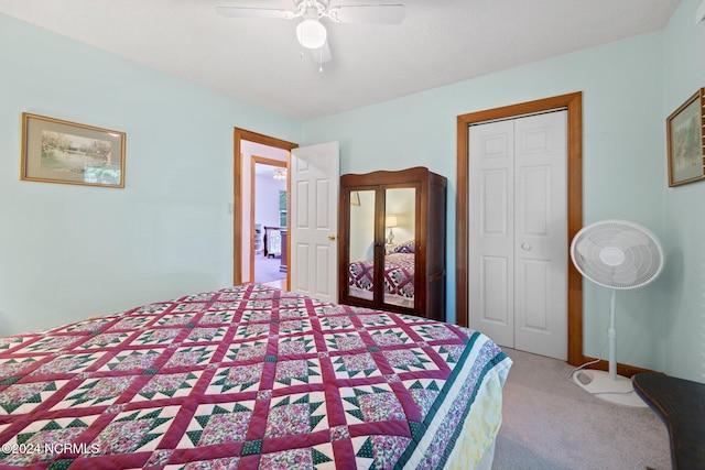 carpeted bedroom with a closet and ceiling fan