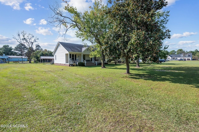 view of yard with covered porch