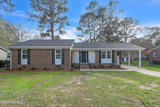 ranch-style home with a front lawn and a carport