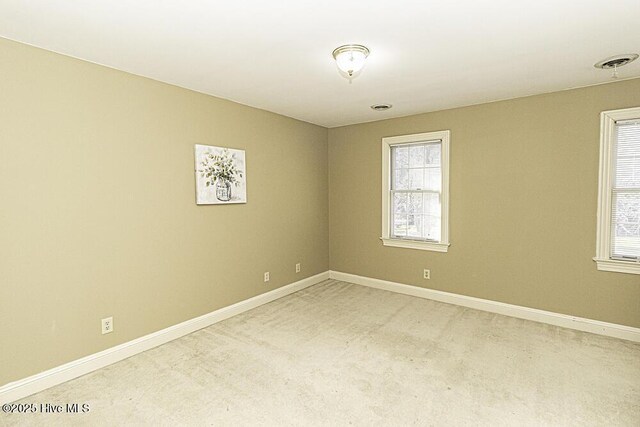 unfurnished bedroom with a closet, visible vents, and baseboards