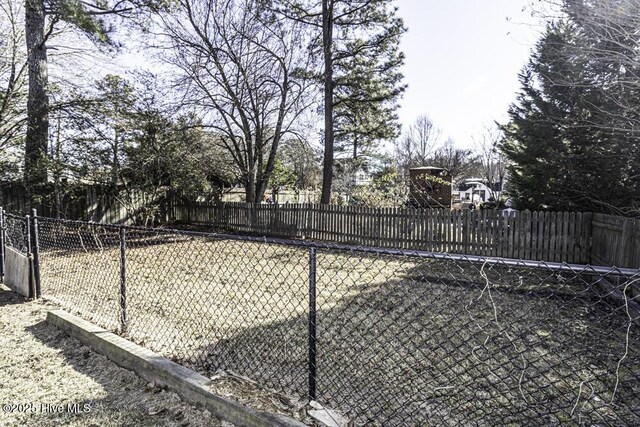 wooden deck featuring entry steps and a fenced backyard