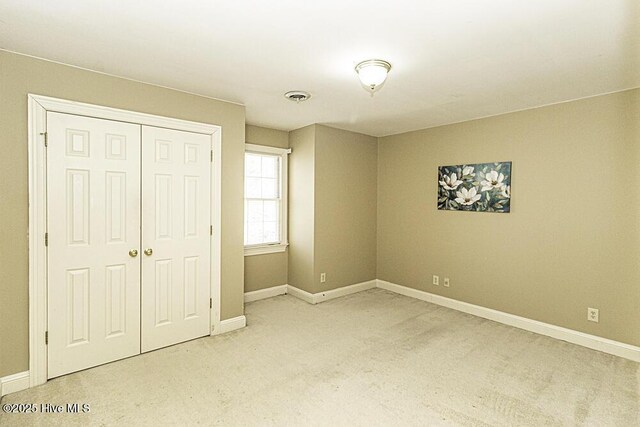 bathroom with wallpapered walls, a shower stall, ornamental molding, and a sink