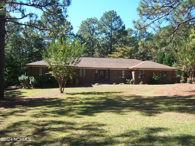 view of front of home with a front lawn