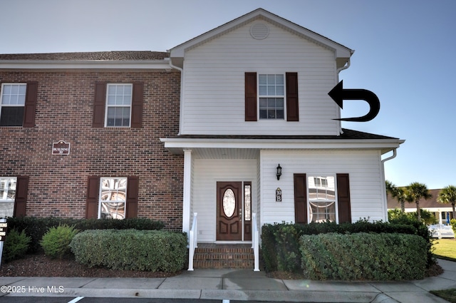 view of front of property with brick siding