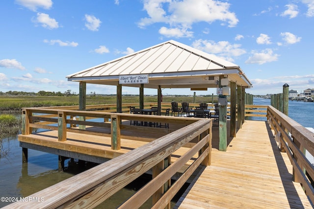 view of dock featuring a water view and a gazebo