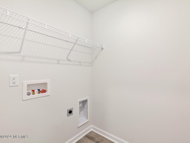 laundry room featuring washer hookup, hookup for an electric dryer, and hardwood / wood-style flooring