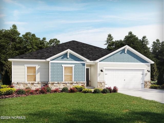 view of front of home featuring a front yard and a garage