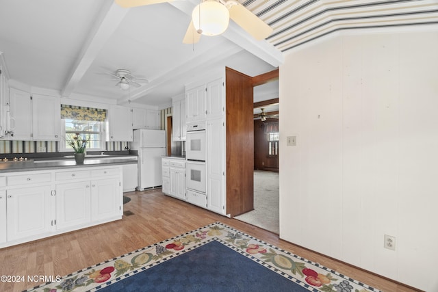 kitchen featuring white cabinetry, light hardwood / wood-style flooring, wood walls, beamed ceiling, and white appliances